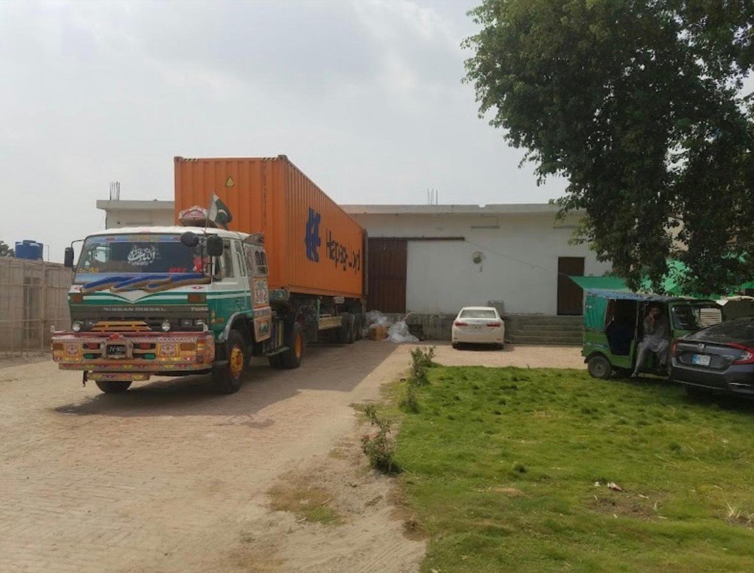 A container being loaded at the ALM Traders yard in Lahore